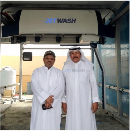 Operators in front of a JetWash gantry